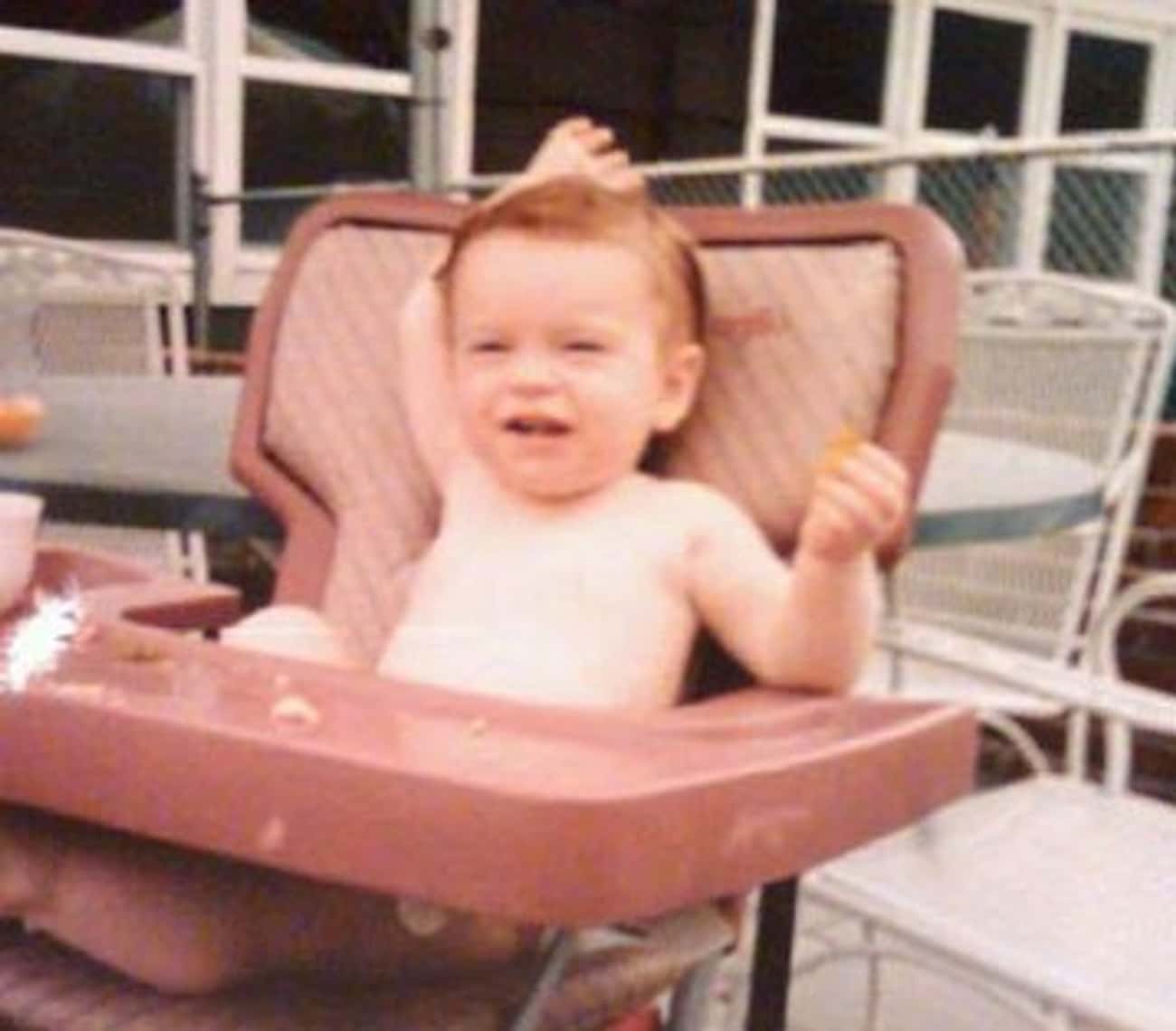 Young Lindsay Lohan Sitting in a High Chair