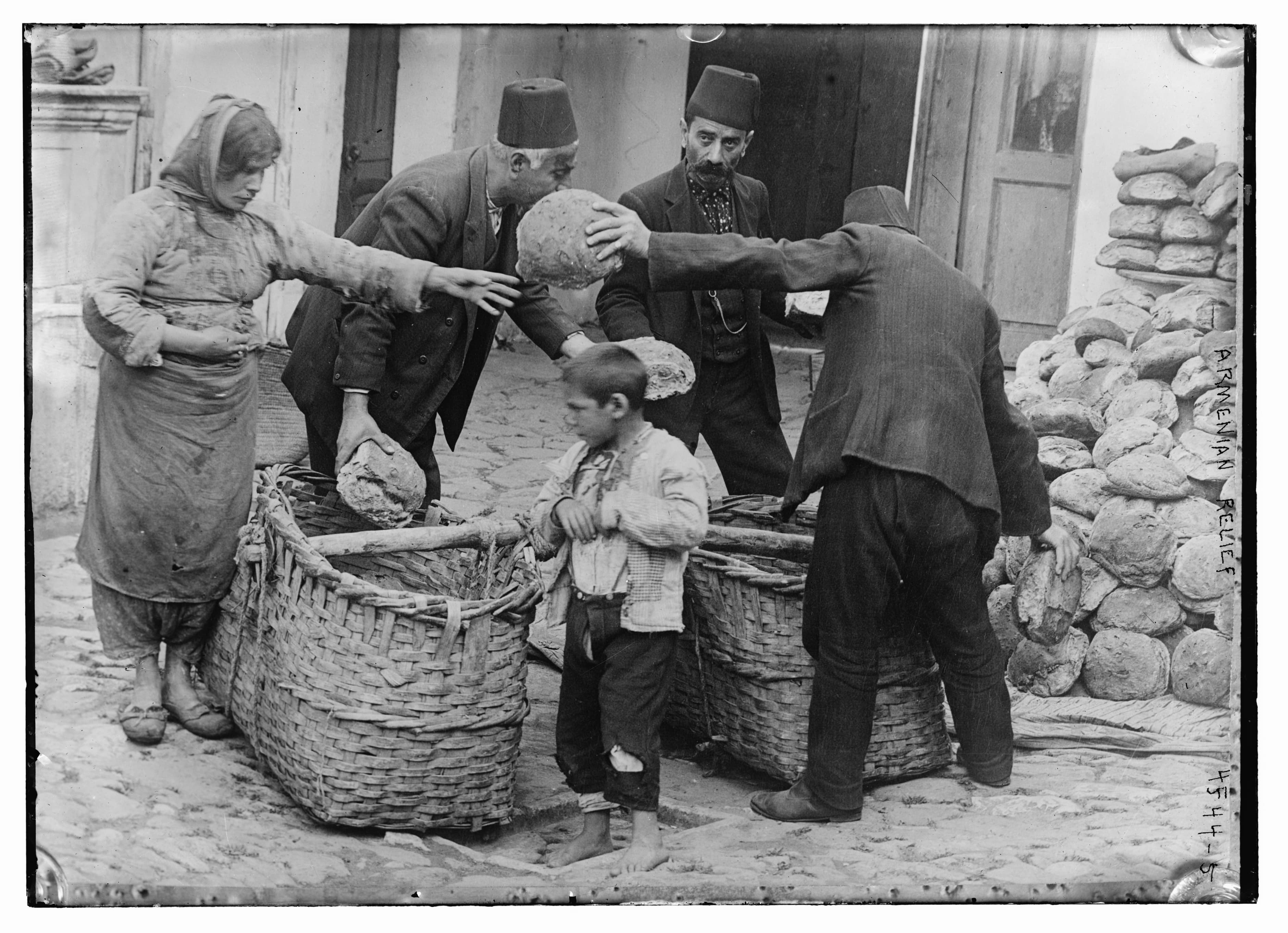 an-armenian-women-and-child-receiving-food-relief-during-the-armenian-genocide-ca-1915-16-photo-u1