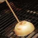 Clean the Grill with an Onion on Random BBQ Hacks Every Grill Master Should Know