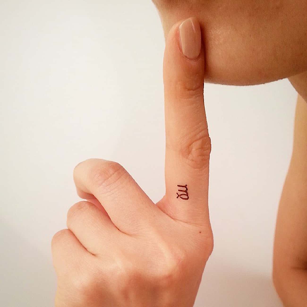 Tiny Symbol on a Finger