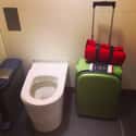 Bringing Suitcases into the Bathroom Stalls on Random Fun Airport Scavenger Hunt Ideas