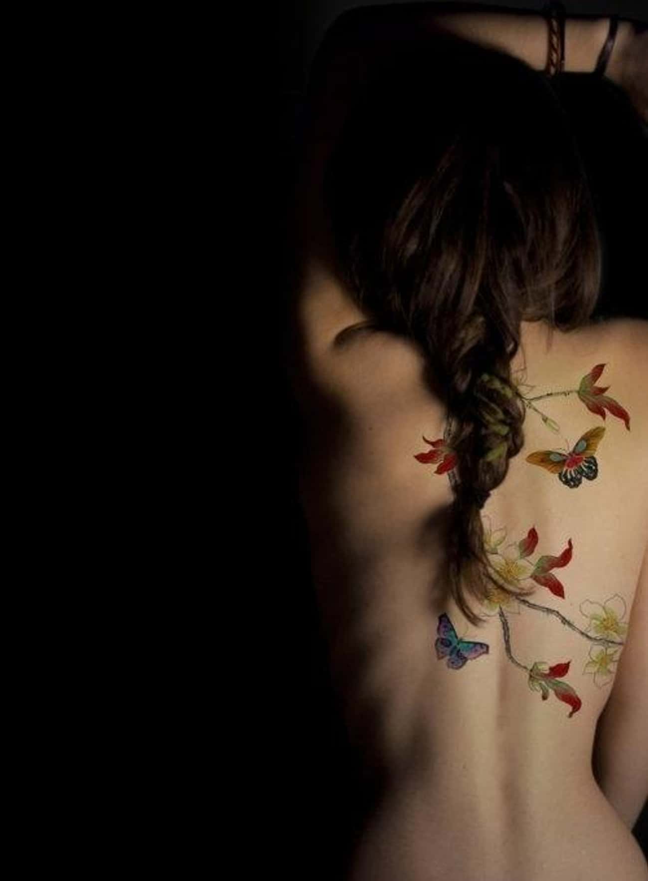 This Delicate Flower Branch and Butterfly Tattoo