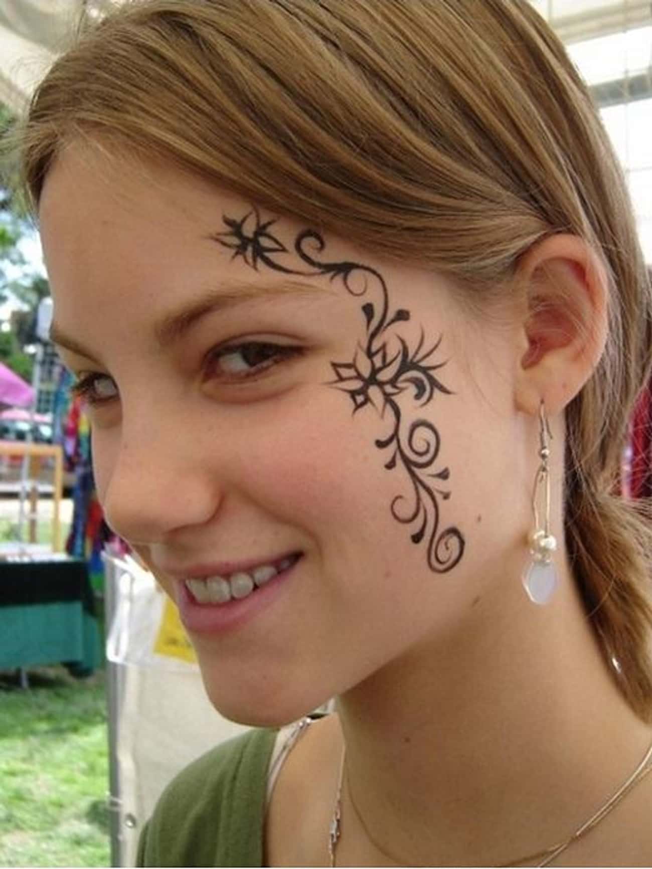 Delicate Flower Face Tattoo