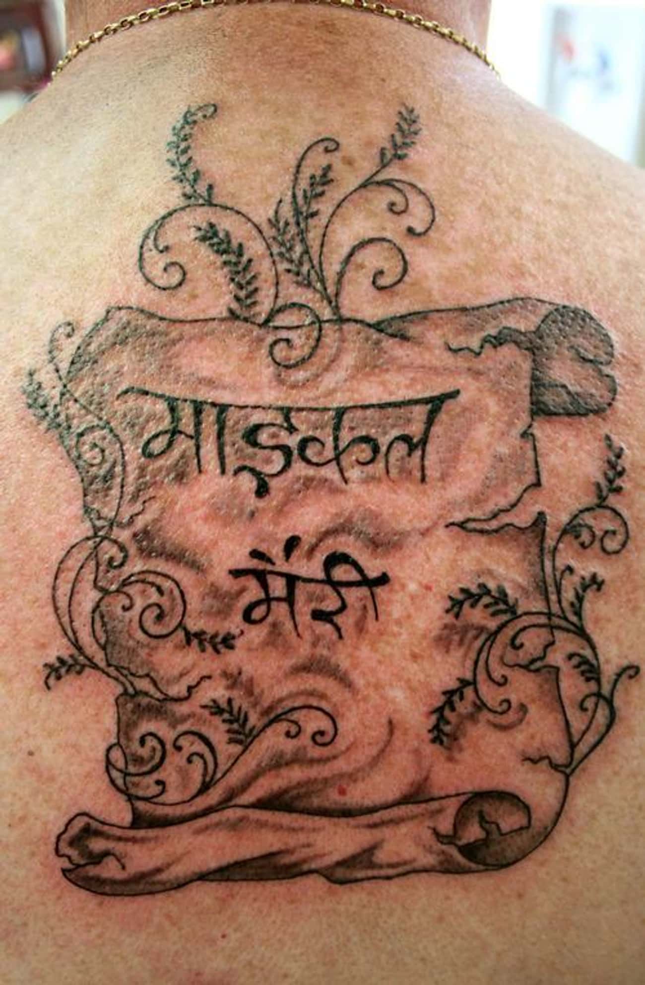 Hindi Lettering Scroll Tattoo On Back