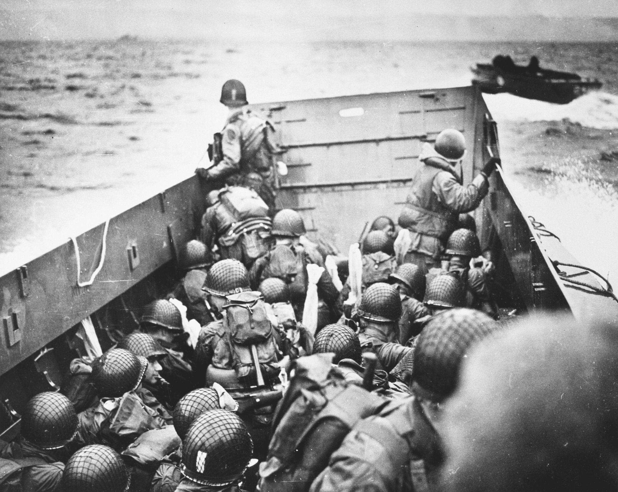 U.S. Troops Crouch Inside An LCVP Landing Craft Before Reaching Omaha Beach 