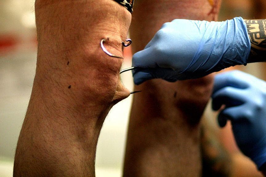 Hanging From Piercings Looks Horrifying, But Body Suspenders Say There ...