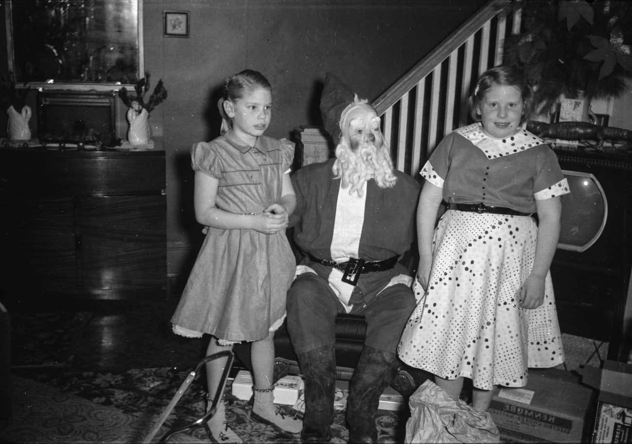 Two Young Girls With Santa, Unknown Year