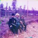 The Photographer And Two Men In Cossak Dress Seated On The Ground on Random These Gorgeous, Century-Old Color Photos Captured Imperial Russia In Years Before Revolution
