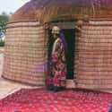 Woman, Possibly Turkman Or Kirgiz, Standing On A Carpet By A Yurt on Random These Gorgeous, Century-Old Color Photos Captured Imperial Russia In Years Before Revolution