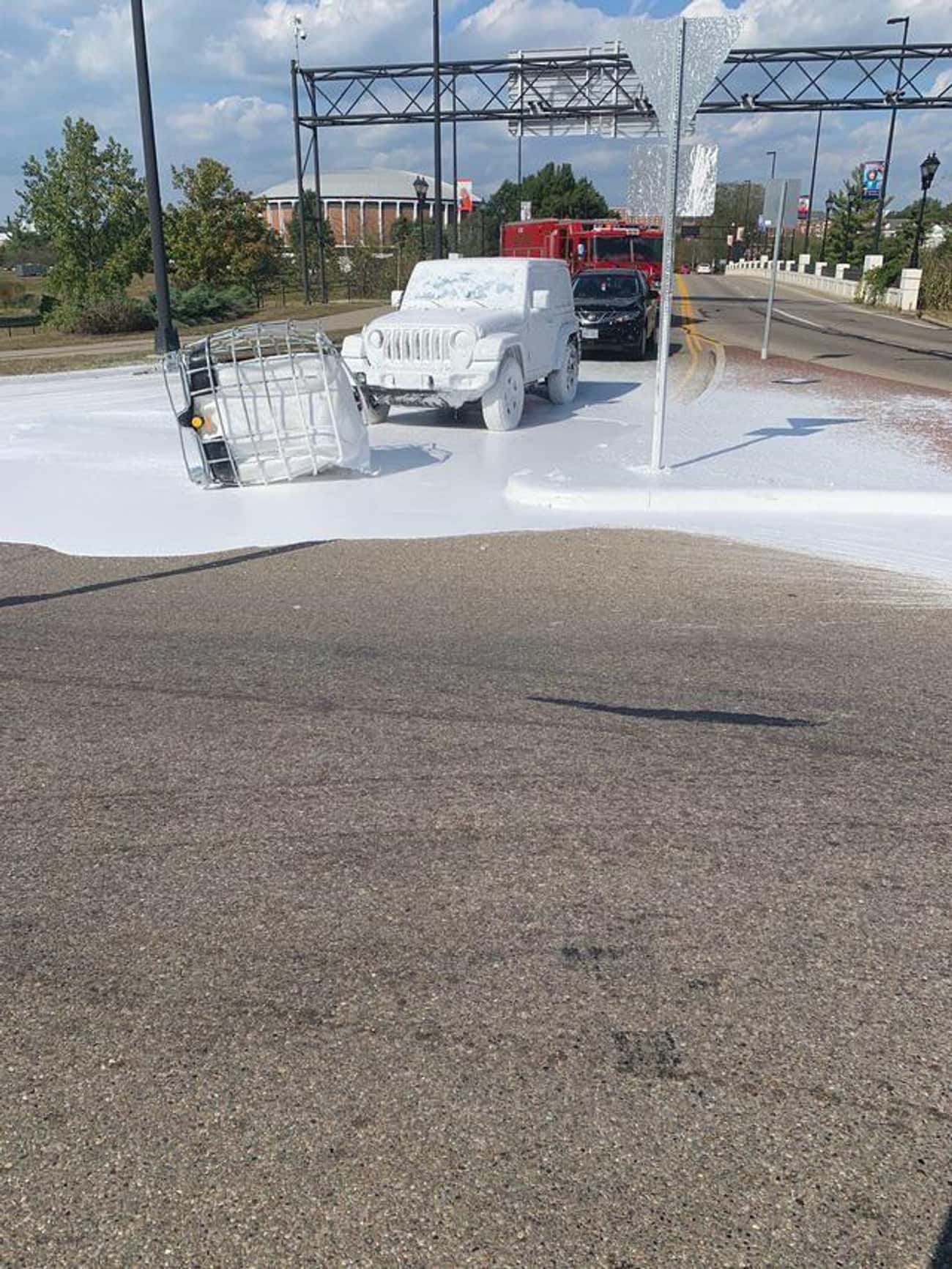 "Truck Carrying White Paint Dropped It On The Road"
