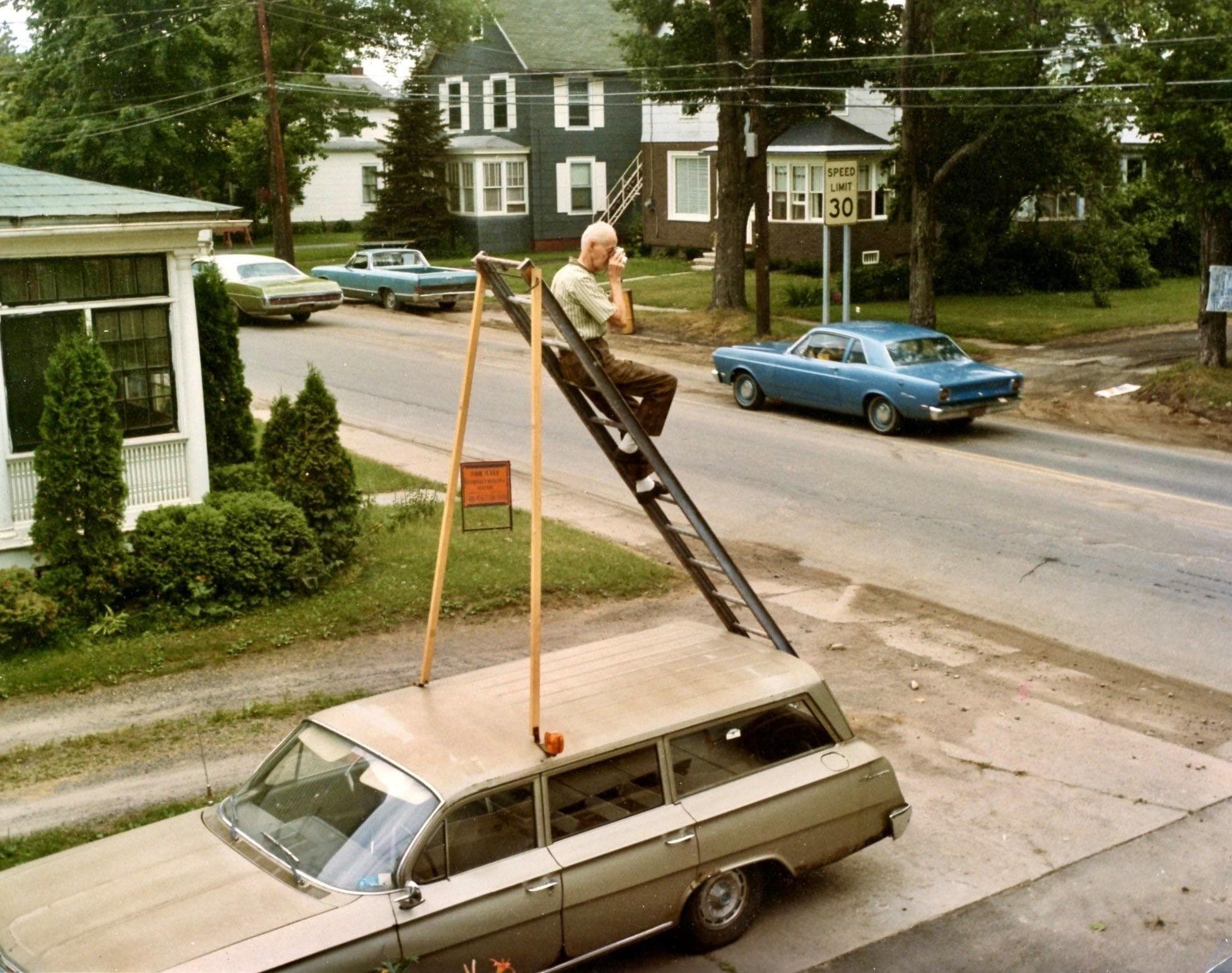 Climbing The Ladder on Random Vintage Color Photos Of People With Classic Cars