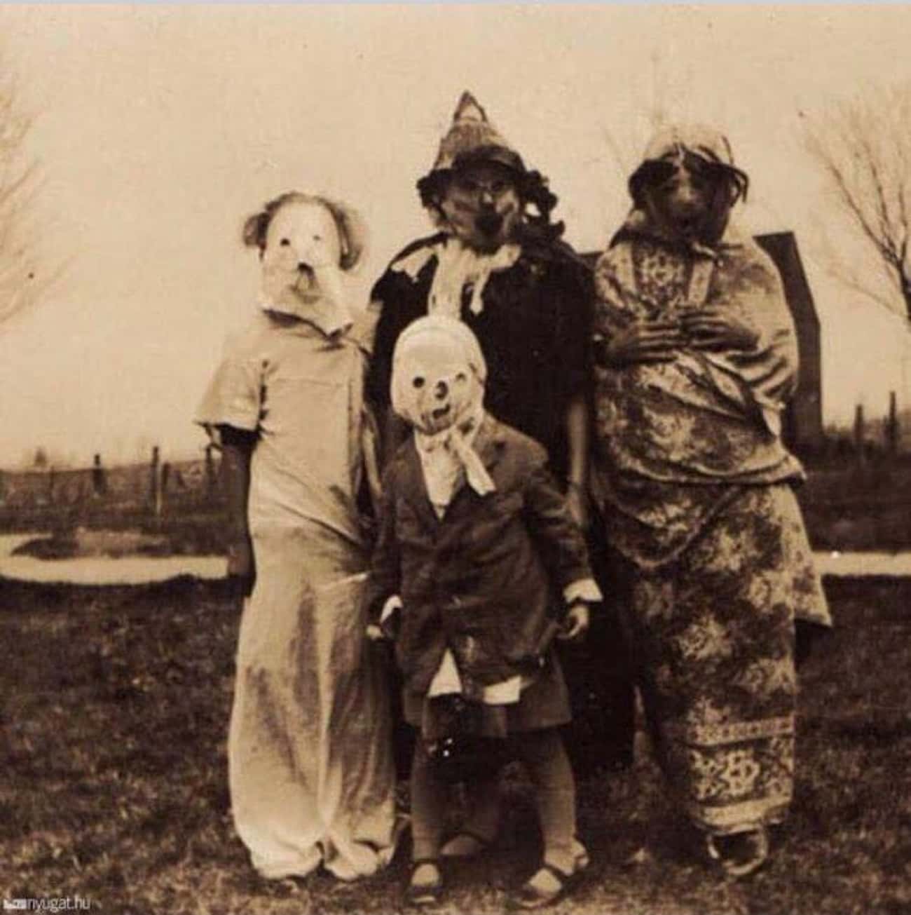 A Costumed Family On Halloween