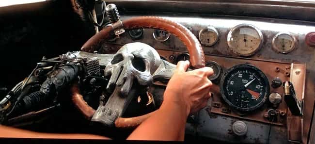 2. A gun magazine can be found on the dashboard of Furiosa's War Rig in Mad Max: Fury Road. This would make it possible for her to reload a handgun with just one hand.