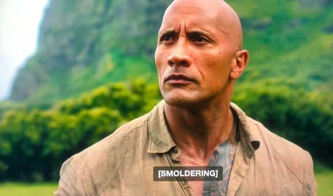 4. The Rock plays Dr. Smolder Bravestone, a video game character, in Jumanji: Welcome To The Jungle. He looks into the distance when he realizes his strength is smoldering. It's easier to understand what he's doing if you have subtitles on.