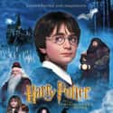 Emma Watson, Daniel Radcliffe, Julianne Hough   Harry Potter and the Philosopher's Stone is a 2001 fantasy film directed by Chris Columbus and distributed by Warner Bros. Pictures. It is based on the novel of the same name by J. K.