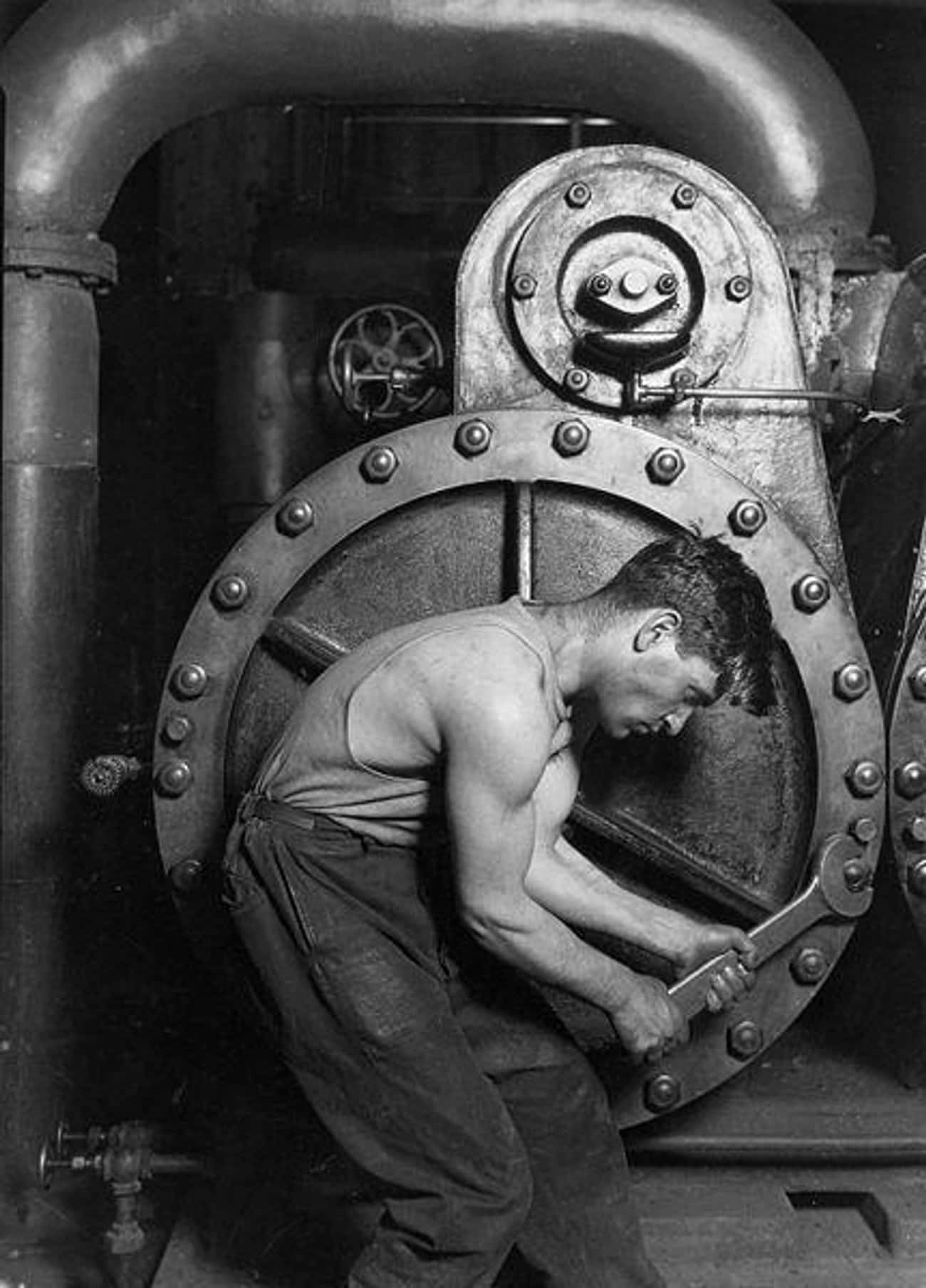 1920: 'Power House Mechanic Working on Steam Pump' By Lewis W. Hine