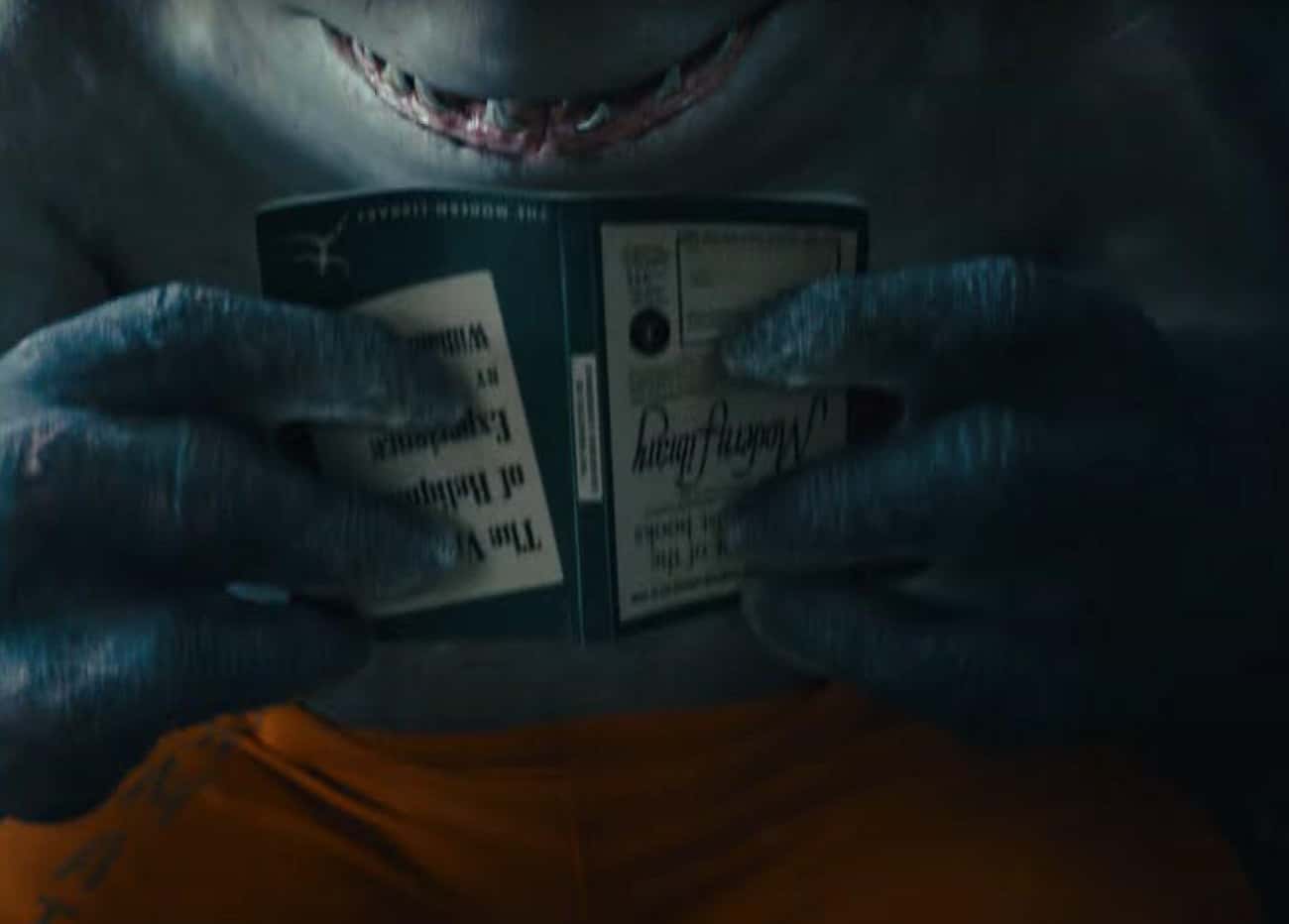 King Shark Is Shown Reading 'The Varieties of Religious Experience' By William James, Which Alludes To His Status As A Demigod