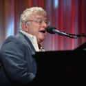 Pop music, Rock music, Soft rock   Randall Stuart "Randy" Newman is an American singer-songwriter, arranger, composer, and pianist who is known for his distinctive voice, mordant pop songs, and for film scores.