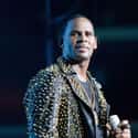 age 52   Robert Sylvester Kelly, known professionally as R. Kelly, is an American singer-songwriter, record producer, rapper and former professional basketball player.